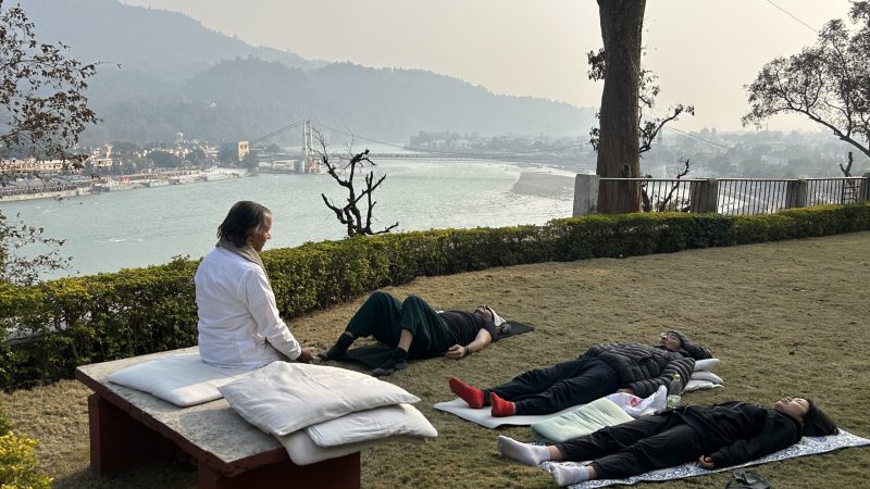 Yoga students practicing meditation at Yoga Niketan Ashram on the banks of the holy Ganga.