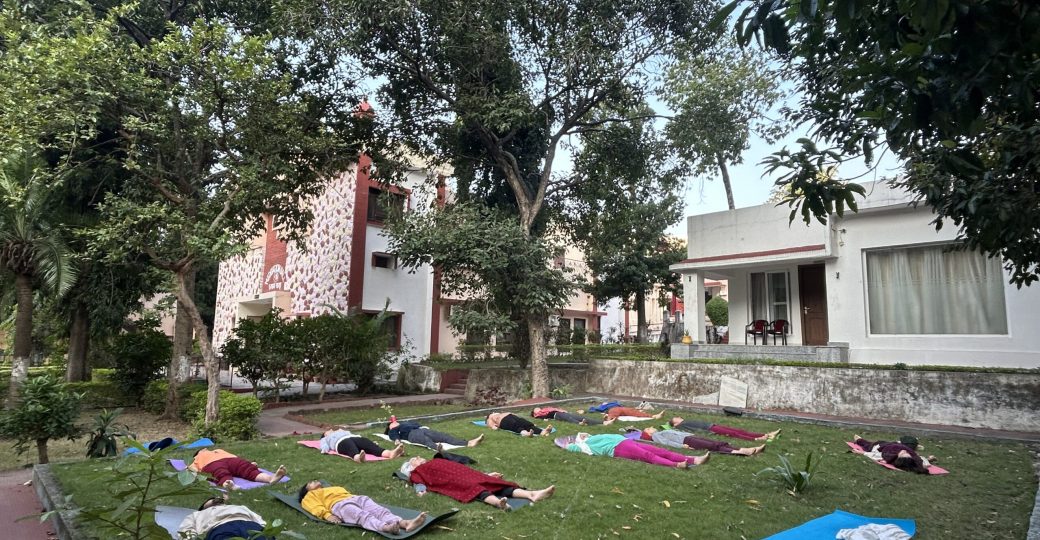 Yoga students practicing meditation at Yoga Niketan Ashram on the banks of the holy Ganga.